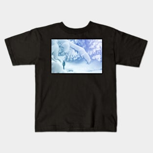 Alone tourist walking through snowy forest Kids T-Shirt